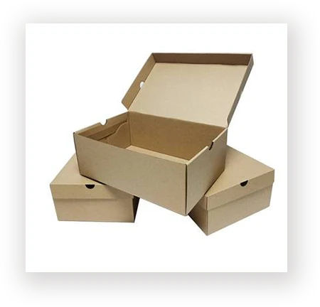 Kraft corrugated shoe boxes stacked with one box open showing the interior