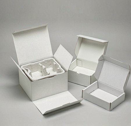 Common apparel packaging box structures: an open folding carton and a rigid box with a paper insert tray
